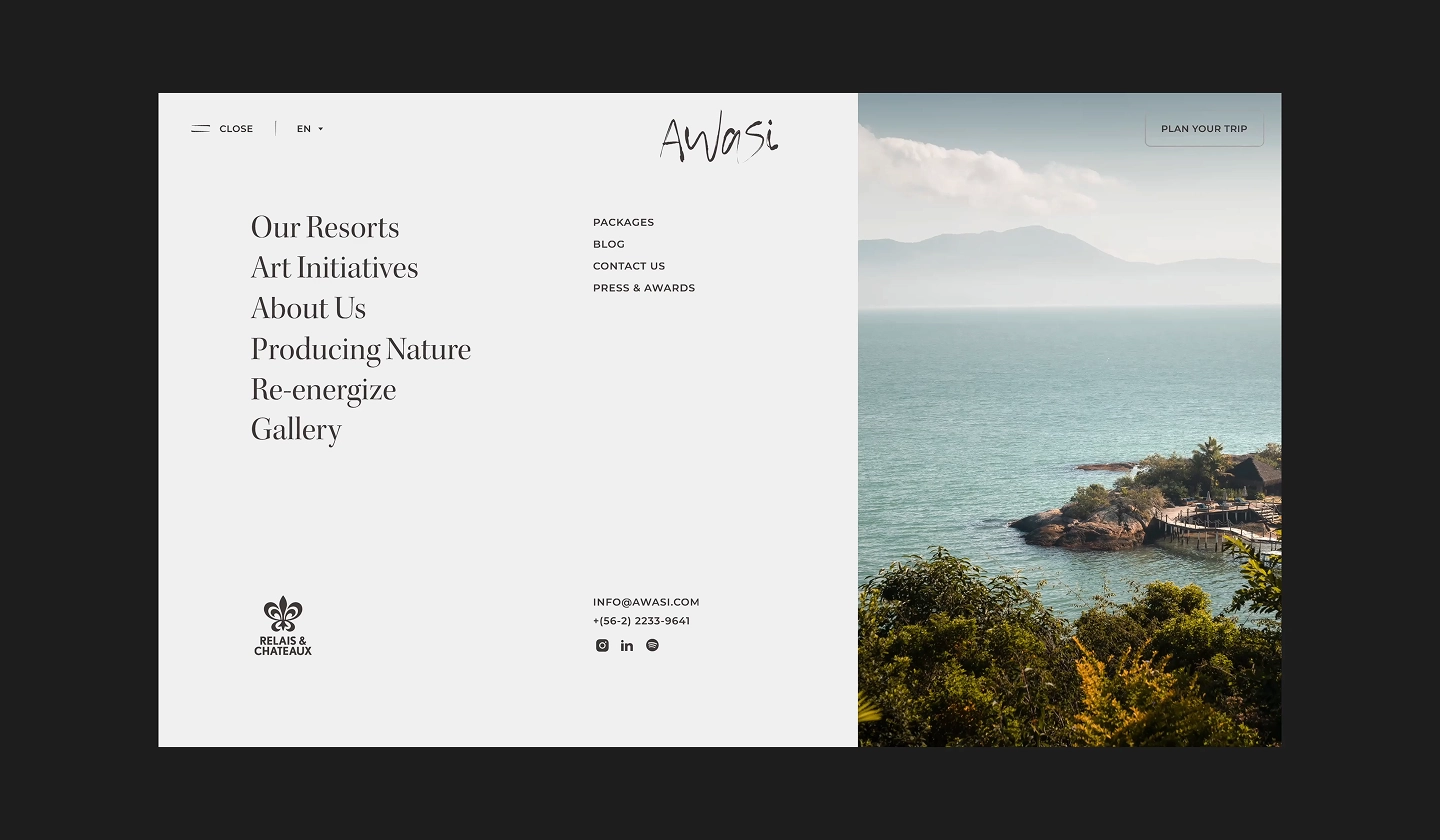 Awasi site split view with menu on left and coastal resort scene with turquoise water on right.